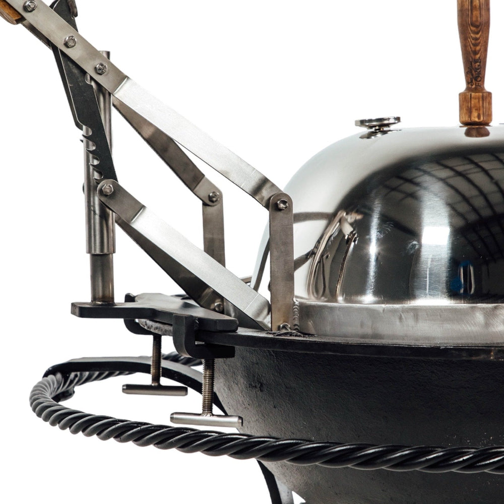 Close-up of a fire pit grill a lid on a white background