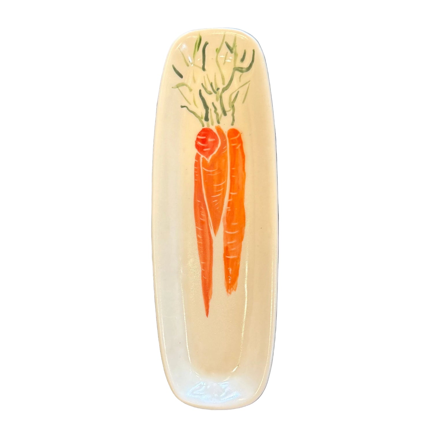 A white ceramic serving platter with a painted orange carrot and green leaf design