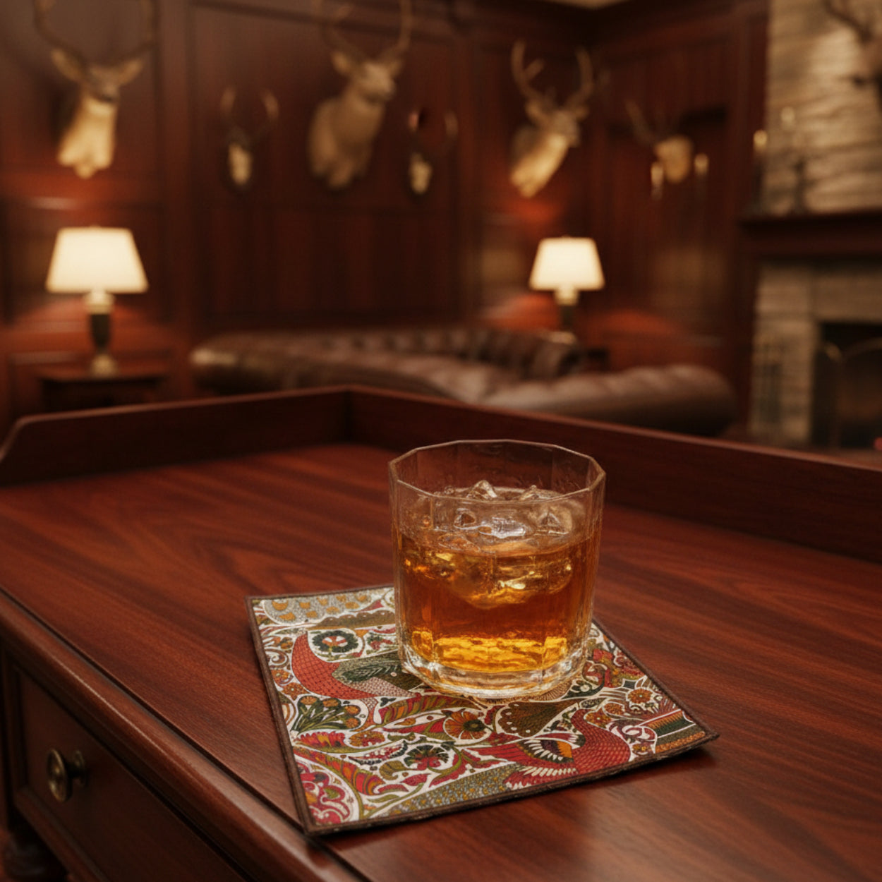 Glass of bourbon on an Oscars Palace napkin in a hunting lodge.