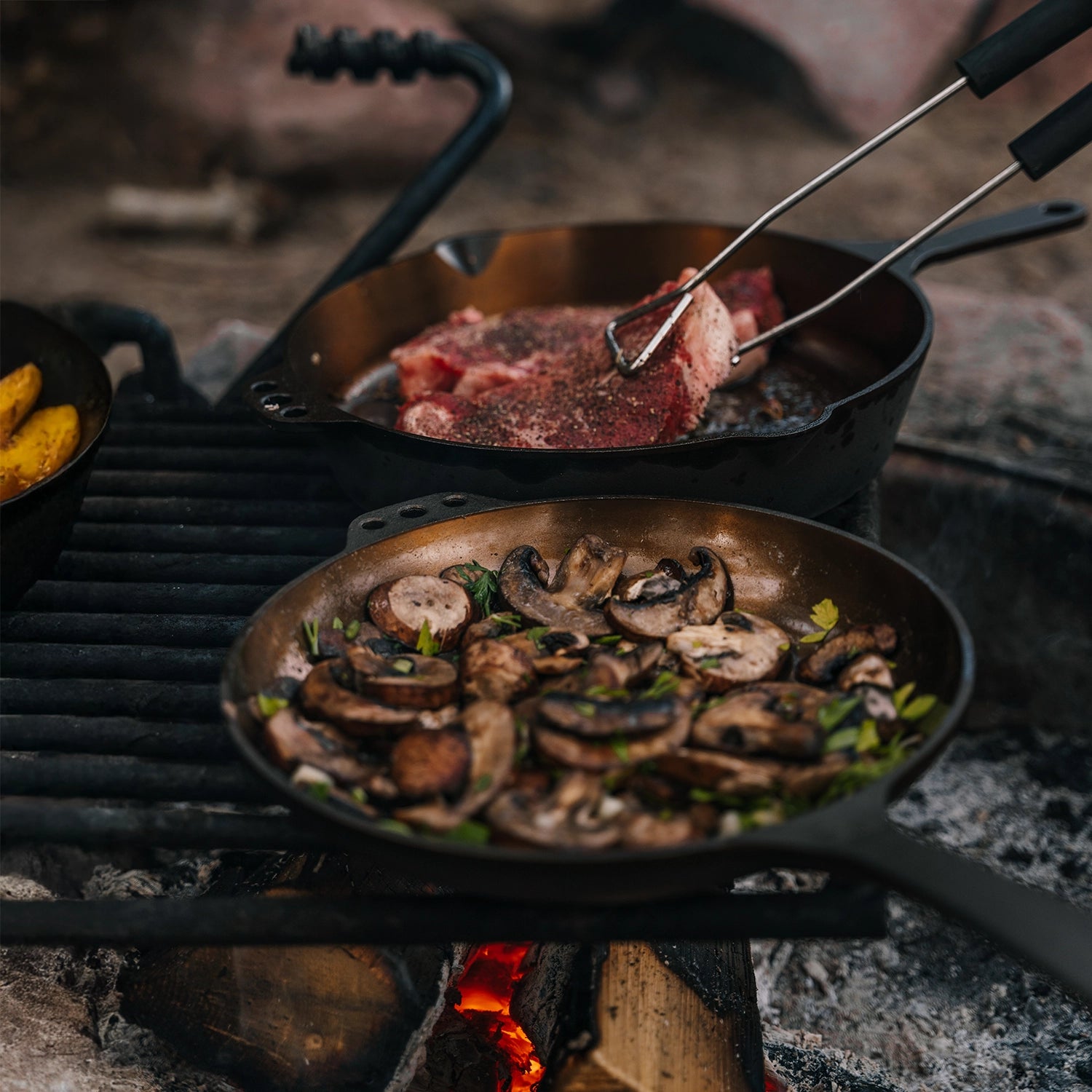 No 8 Chefs Pan Sauteeing Mushrooms on a Fire