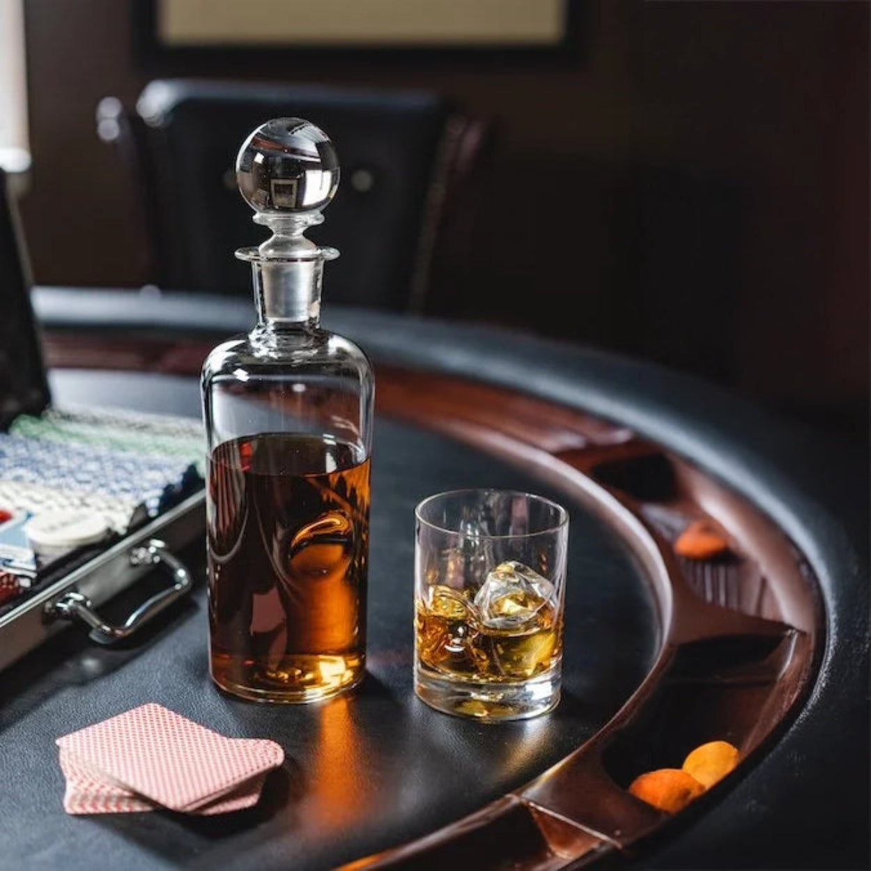 Whiskey decanter and glass on a table with a blurred background